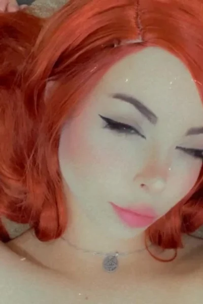 Amanda Welp laying on the couch and teasing her perfect tits