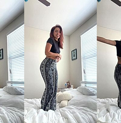 Angela Alvarez jumping up and down in bed