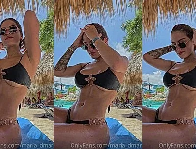 Maria Del Mar teasing her bikini body by the beach