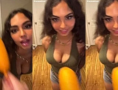 layladeline eating a corn-dog on tiktok