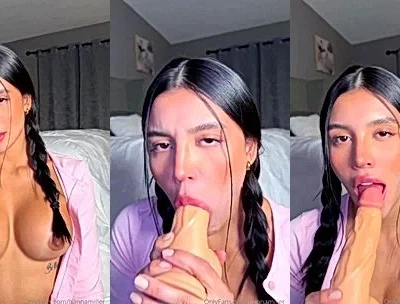 pigtail Latina babe Hanna Miller sucking on a big dildo