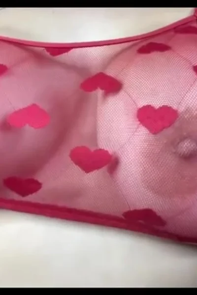 Britt Cuadra squeezing her big tits in her red see-through bra