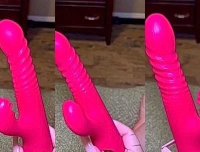 Britt Cuadra playing with her pink dildo sex toy