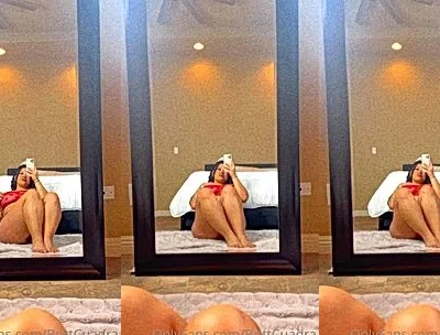 Britt Cuadra teasing her big tits in the mirror