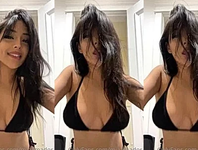 sexy Latina babe Neiima teasing her sexy black bikini in the bedroom