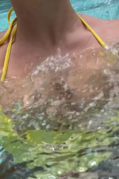 Genesis Mia Lopez teasing her wet big tits wearing yellwo bikini in pool