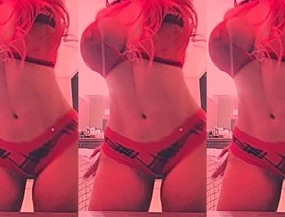 DanyanCat teasing her big tits in red lingerie
