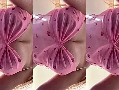 DanyanCat teasing her big tits in pink outfit