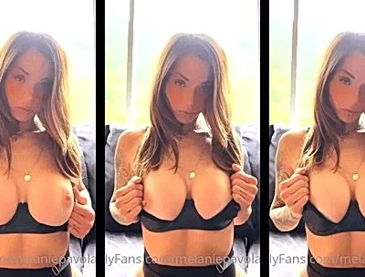 Melanie Pavola teasing her big tits in her black lingerie
