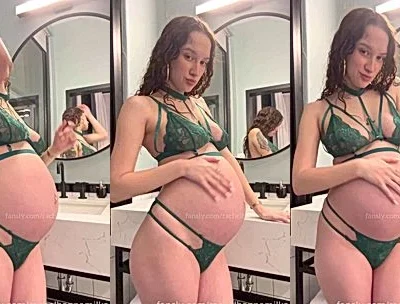Rachel Hanna teasing her pregnant belly in green lingerie