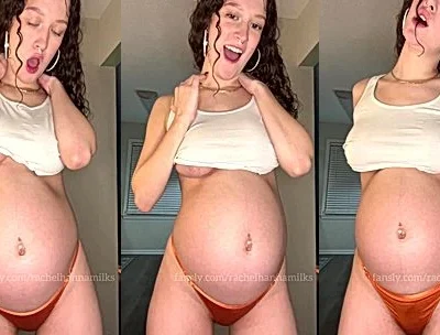 Rachel Hanna playing with her pregnant belly in the bedroom