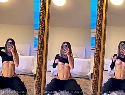 Melanie Pavola showing off her big tits in the mirror