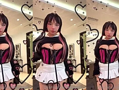 Katiana Kay teasing her big tits in her pink corset