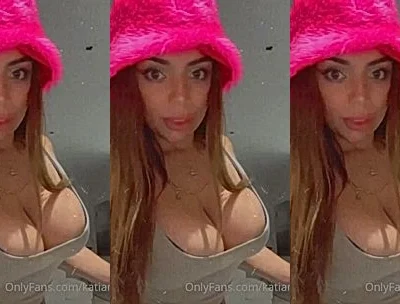 Katiana Kay showing off her big tits wearing a pink hat