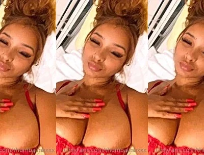 THUMBALINA showing off her big boboies in red lingerie