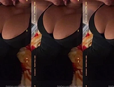 THUMBALINA teasing her big tits in black dress