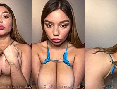 Katiana Kay teasing her big tits in her thin blue bikini