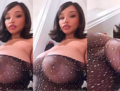 THUMBALINA teasing her big tits in see-through bodysuit