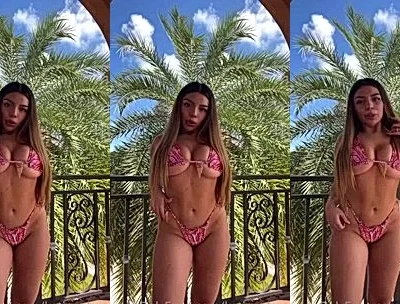 Katiana Kay teasing her big tits while dancing