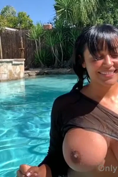 Emily Cheree teasing her wet big tits in the pool